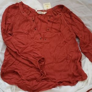 Rust colored top with hook and eye closure